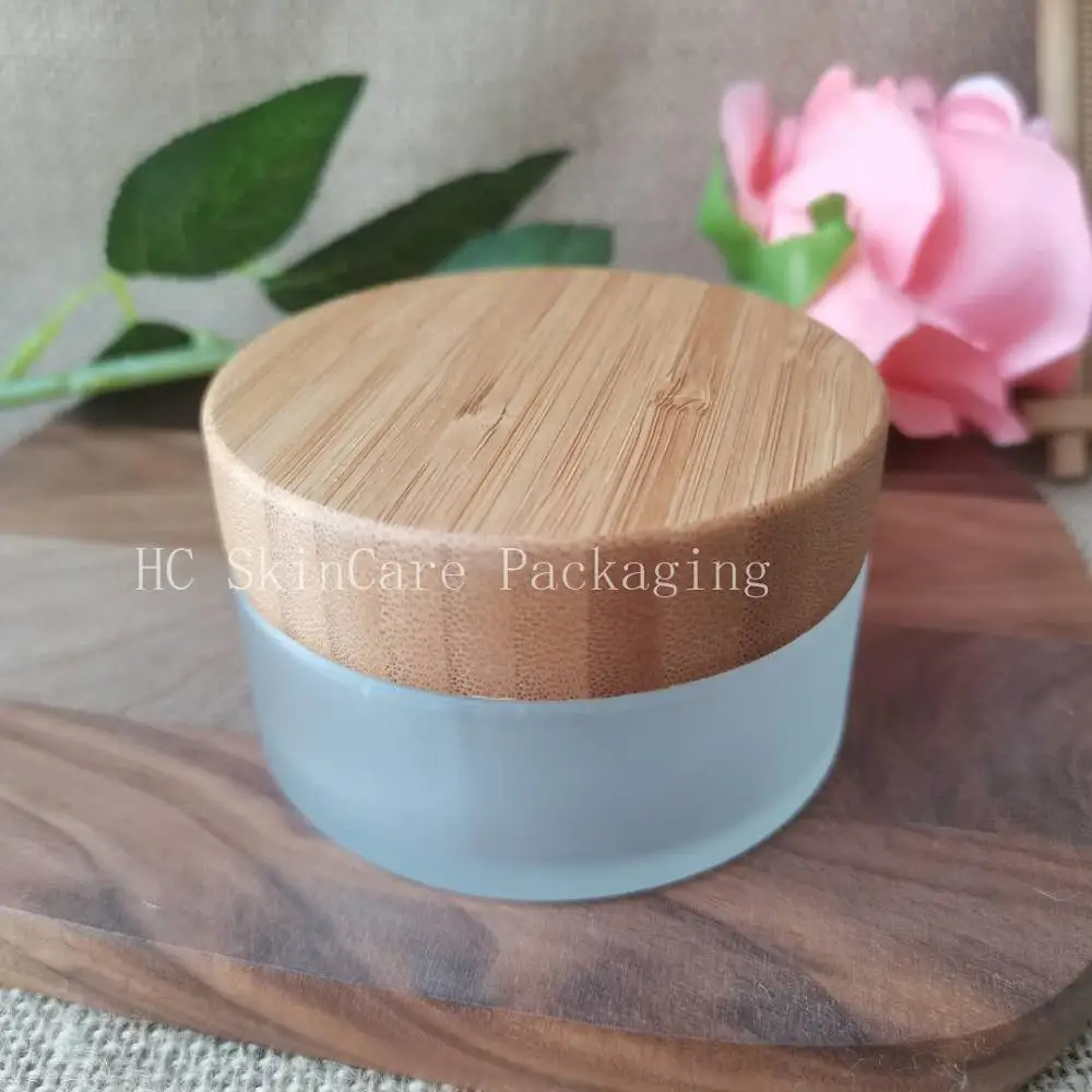

Wholesale 100g Glass Empty Containers Jars For Cosmetics With Bamboo Lid Face Cream Lip Gloss Makeup Packaging Jars