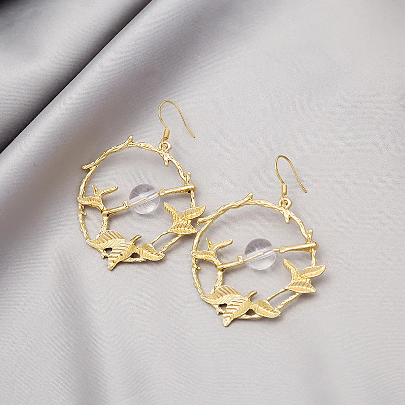 

Korean version of the retro small fresh hollow leaf circle earrings simple fashion branch ball earrings earrings