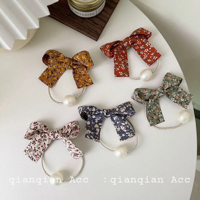 

Женская резинка для волос с искусственным жемчугом и бантом