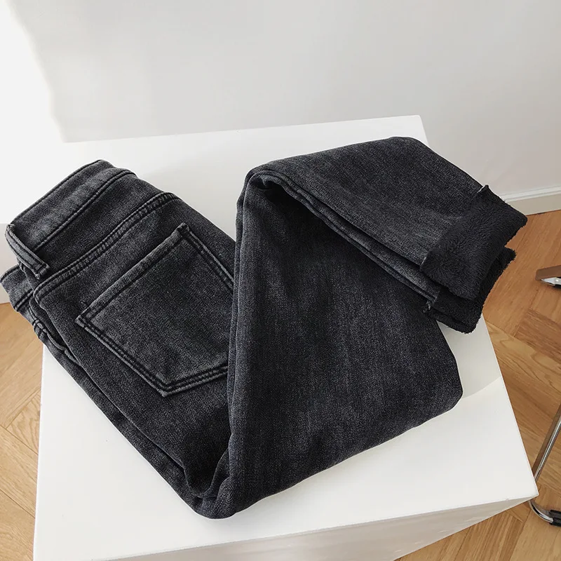 

Winter plus velvet jeans women's high waist 2021 new thickened warmth and thin feet solid color wild pants