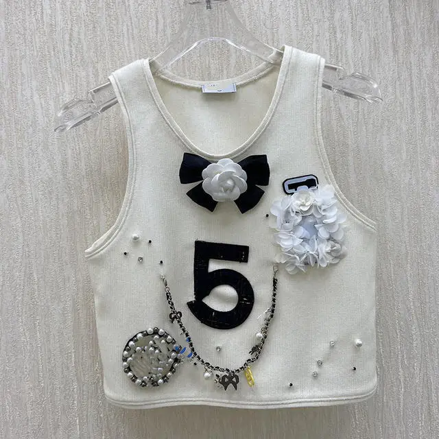 

Star's same 2021 small fragrance early spring new black and white camellia with bottom strap vest