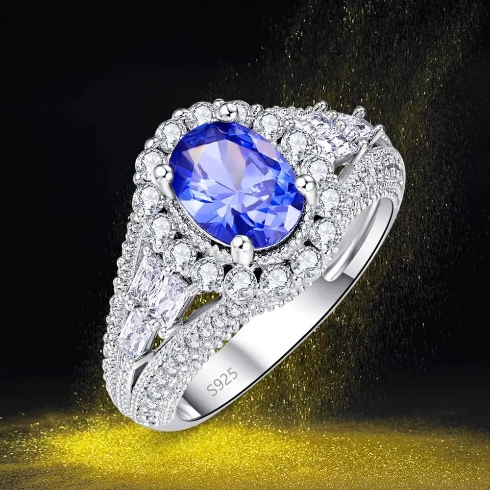 

Женское кольцо из серебра 925 пробы с овальным танзанитом и белым топазом