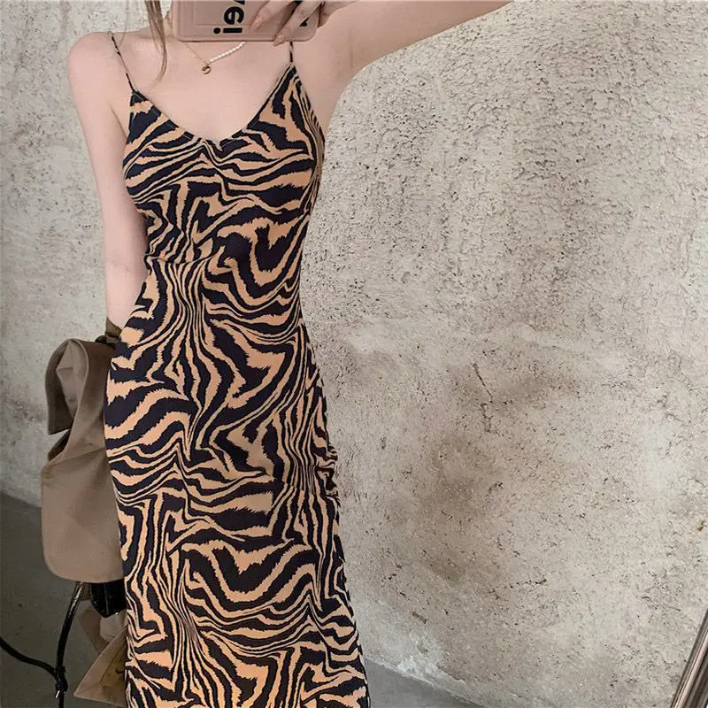 

Single/suit suit jacket feminine trendy autumn temperament retro leopard print mid-length sling dress two-piece set.