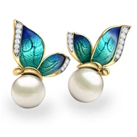 ofertas wholesale bulk hot sale luminous butterfly animal white pearl elegant alloy stud earrings for women