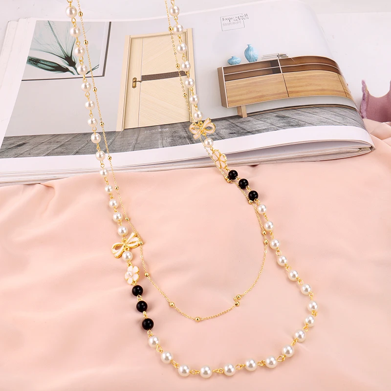 Колье многослойное женское с жемчугом длинное ожерелье камелией и бантом модная