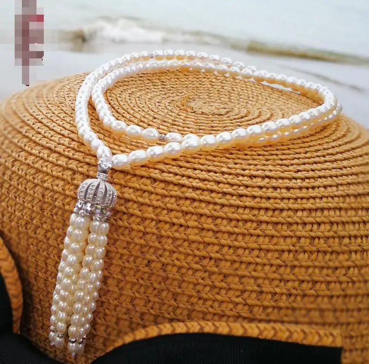 

Natural freshwater 8-10mm Rice type pearl white sweater chain ladies new necklace 50inch