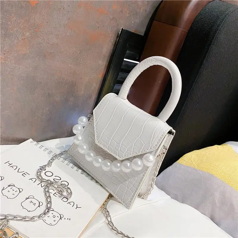 

synthetic leather handbag, synthetic leather handbag with pearl handle, postman and hand and shoulder style with stone print