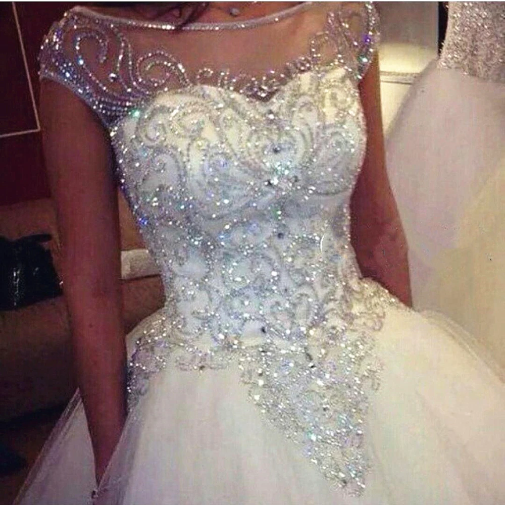

Sparkly Crystals Wedding Dresses Cap Sleeve Sheer Back Scoop Neck Shiny Diamonds Ball Gown Luxury Bridal Gowns vestido de noiva
