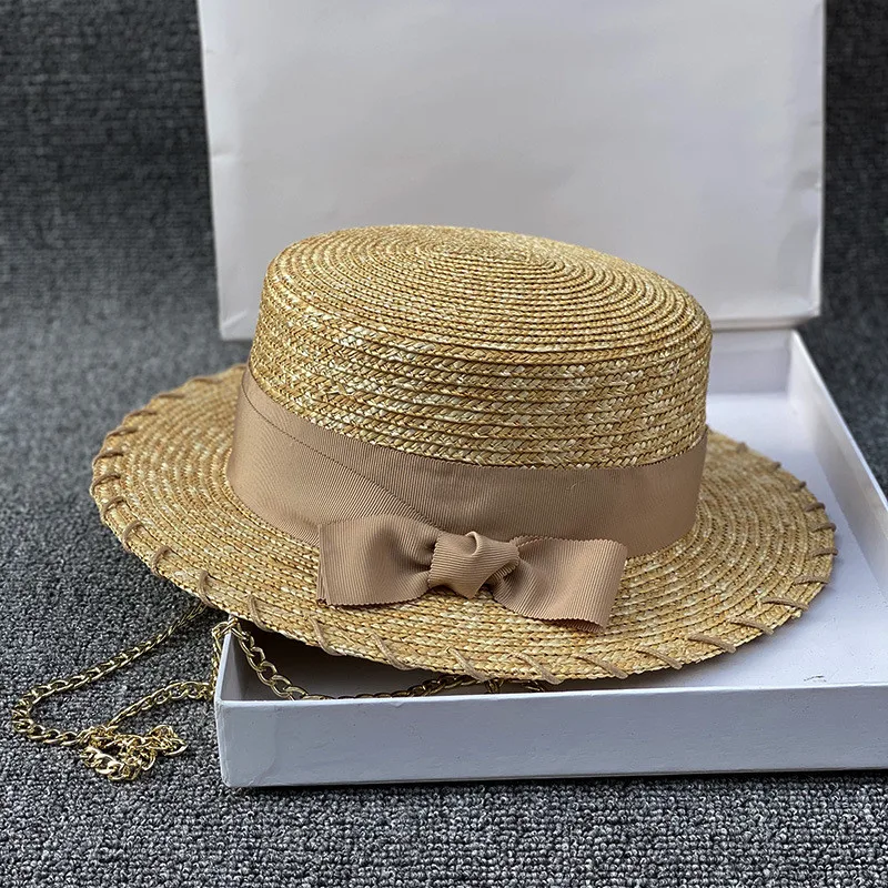 

202105-xintao-chain fashion summer handmade straw bowknot gold chain lady fedoras cap women panama jazz hat