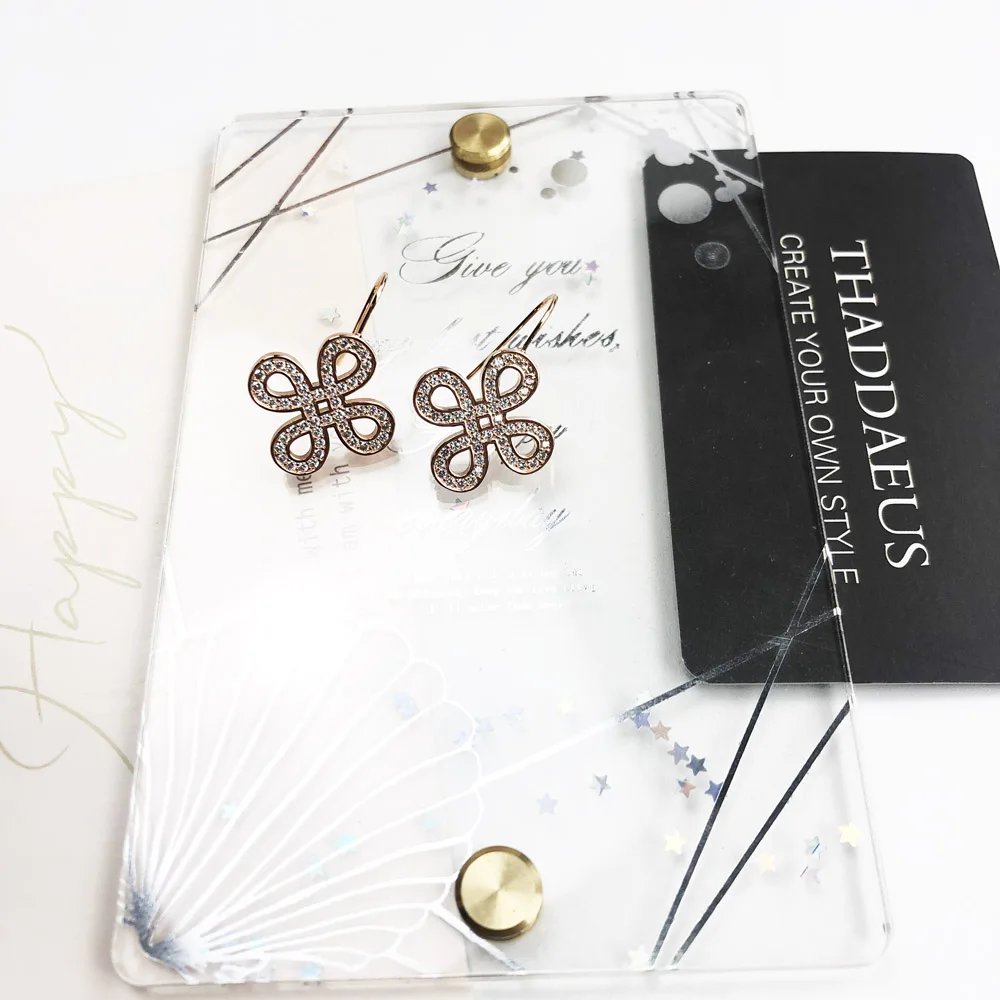 Серьги подвески в виде любовного узла цвета розового золота романтические