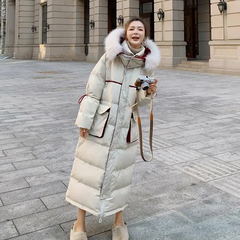

Женский зимний пуховик средней длины, с воротником-стойкой