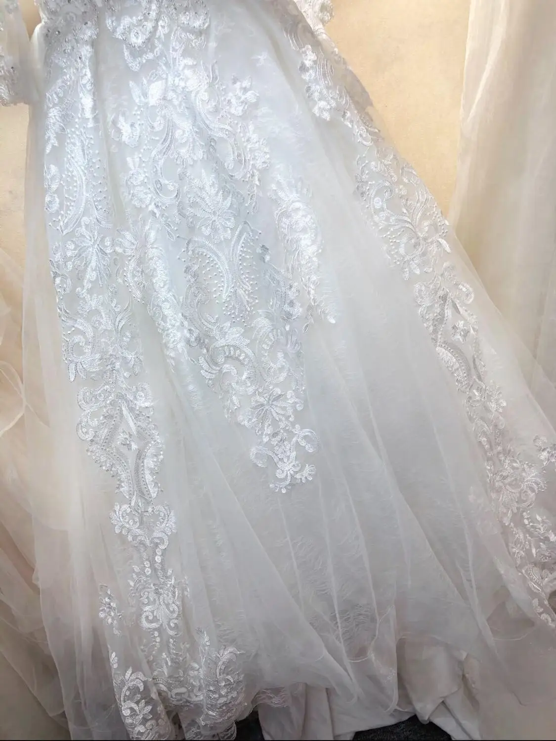 

Exquisite heavily beaded in stock size US4=UK8=Europe34 long sleeves bridal wedding gowns