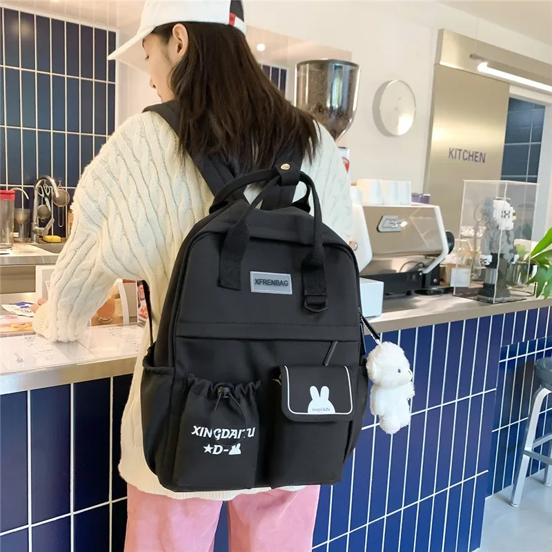 

Fashion Women Backpack Trend Pendant School Bag For Girls Large Capacity Backpacks With Many Pockets Solid Color Travel Backbags