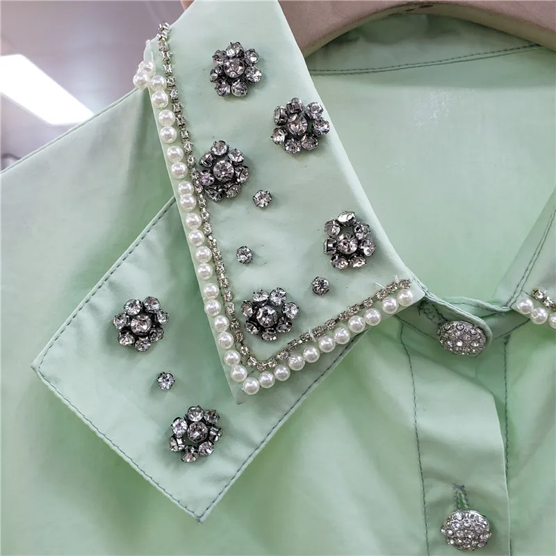 Chemise courte pour Femmes 2021 Été Nouveau Simple Boutonnage Manches Bouffantes Exquis Strass Revers Tout-Assorti Haut Court Dame Blusas