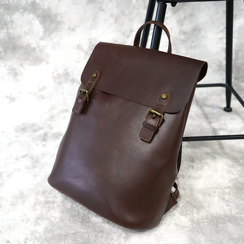 

Xiaoning British handmade head leather men's backpack fashionable women's Leather Backpack leisure fashion European and American