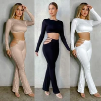 autumn european and american tight fitting solid color sexy tight fitting hollow womens two piece female