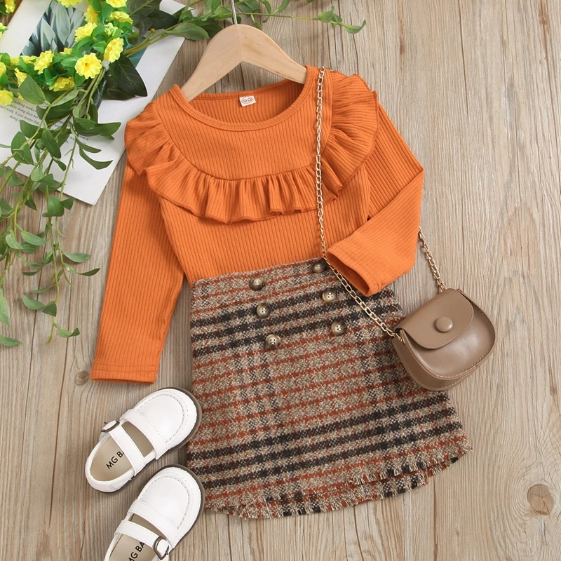 

Toddler Baby Girl’s Outfits Two Piece Suit Autumn Fashion Solid Color Long Sleeve Ribbed Tops and Plaid Button Short Skirt Set