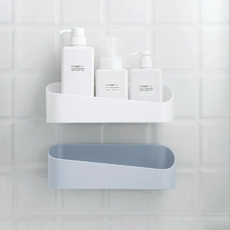 

The bathroom is strongly pasted to the wall-mounted plastic free punching wall storage rack geometric modeling bathroom rack