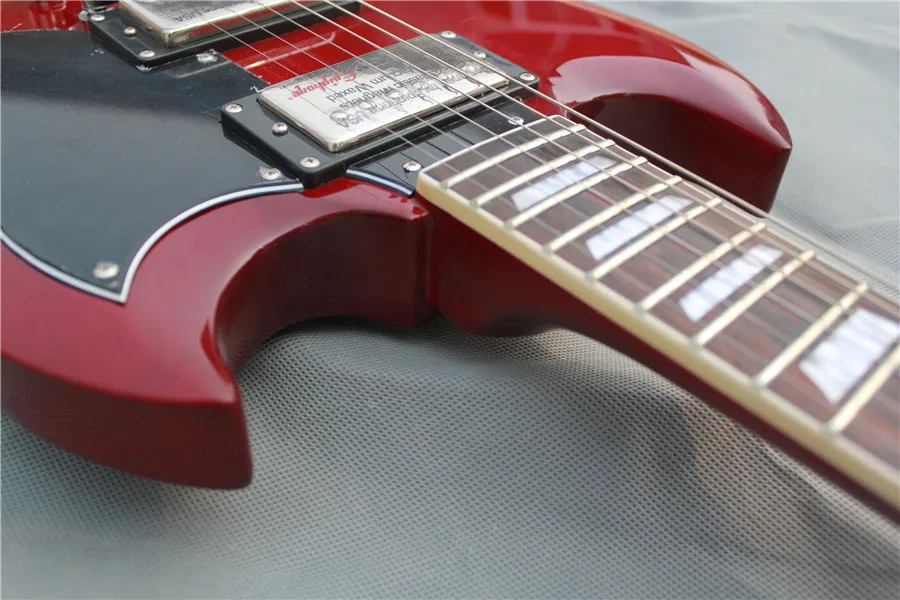 

free shipping custom electric guitar,red\black guitar,mahogany body eck,rosewood fingerboard with shell inlay,free delivery