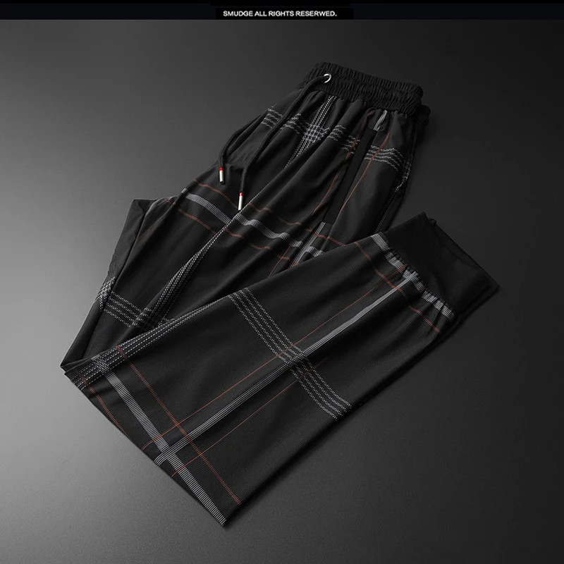 

Summer new quality men's light and thin silky sports casual trousers Korean version of slim-fit small feet plus size men's trous