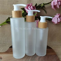 whoelsale 100120150ml matte glass bamboo cap lid lotion pump glass bottles cosmetic container packaging shampoo bottle