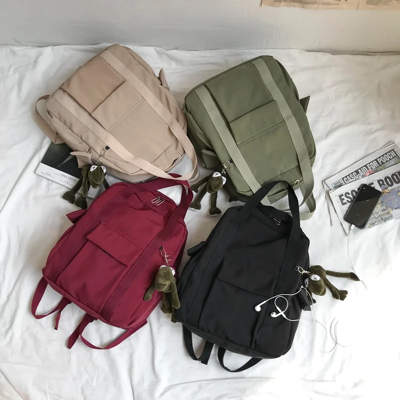 

2021 New School Backpack Solid Color Women'S Waterproof Nylon Backpack Simple School Bag For Teenage Girl Shoulder Travel Bag