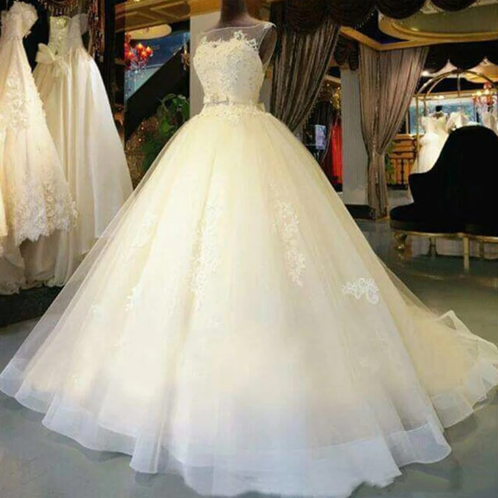 

2020 Beautiful A-Line Sleeveless Tulle Wedding Dresses Illusion Neckline Appliques Elegnat Bridal Gowns Custom Made Court Train