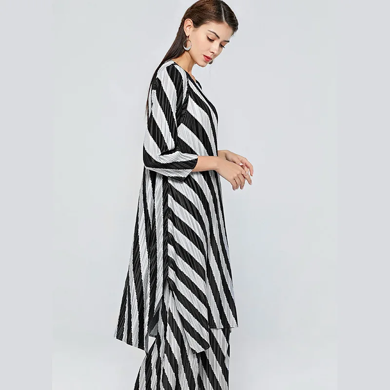 Striped female 2020 spring new style Miyake fold elastic split irregular long shirt + long trousers two piece set top and pants