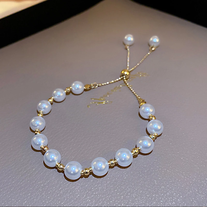 

Elegant Imitation Pearl Beads Bracelet Copper Zircon Sunflower Bowknot Pendant Adjustable Chain Bracelet For Women