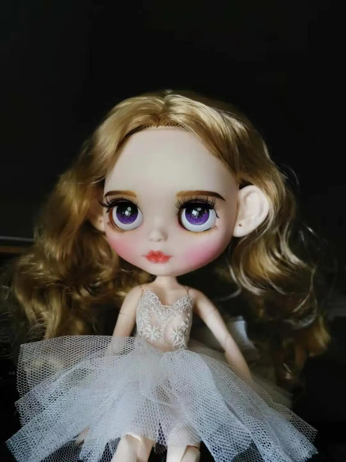 

Blond curly hair temperament doll Excluding clothes.