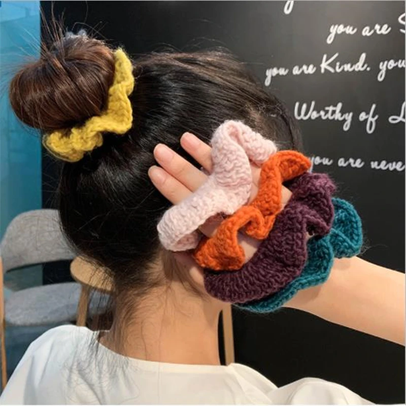 

Autumn and winter new wool knitted large intestine hair ring Korean net red head decorated with ball head simple hair female