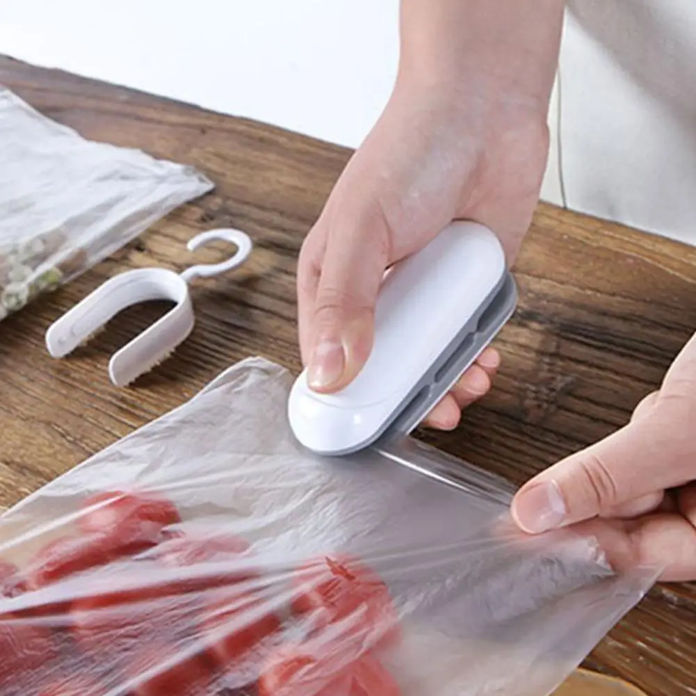 

Portable Mini Plastic Bag Sealer Home Heat Bag Plastic Food Snacks Bag Sealing Machine Clip With Hook Vacuum Sealer