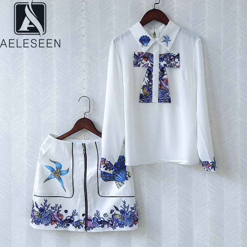 

AELESEEN/модные летние комплекты из 2 предметов; Коллекция 2021 года; Повседневная белая элегантная рубашка с бусинами + мини-юбка с цветочным прин...