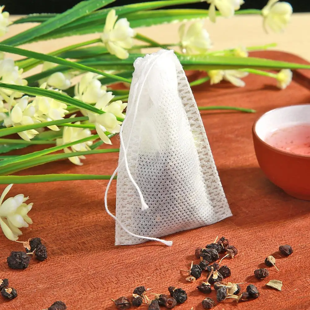 

Tea Bags 100Pcs/Lot Empty Scented Drawstring Pouch Bag 5*7CM Seal Filter Cook Herb Spice Loose Coffee Pouches Tools