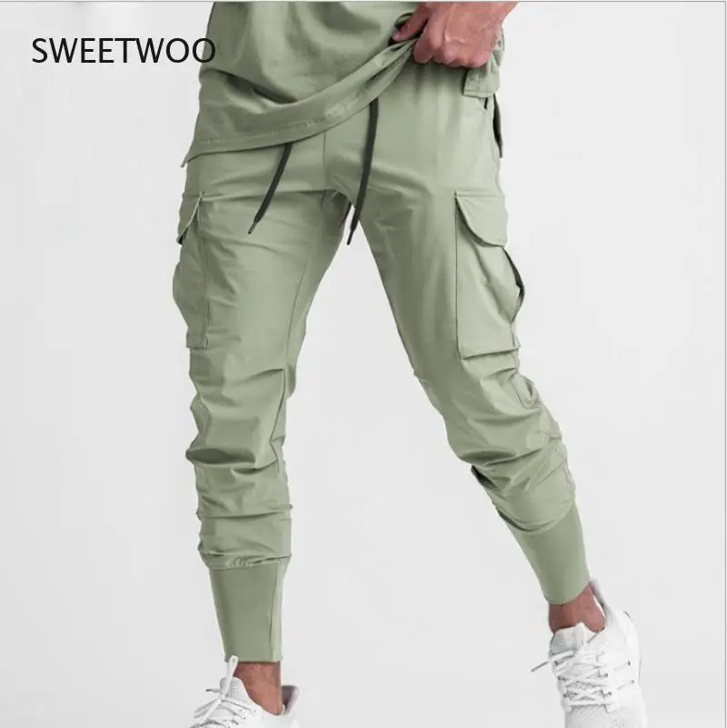 

Новинка 2021, спортивные мужские брюки для фитнеса, весенние тонкие свободные быстросохнущие Стрейчевые тренировочные брюки для бега и трени...