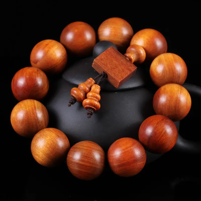 

Indonesian Ice Kind of Light-Transmitting Blood Dragon Wood Hand Grain Fine Grinding Seiko Hole