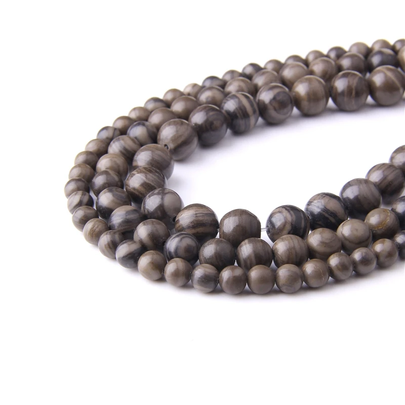 Полированный круглый камень коричневого цвета в виде снежинки обсидиана 15