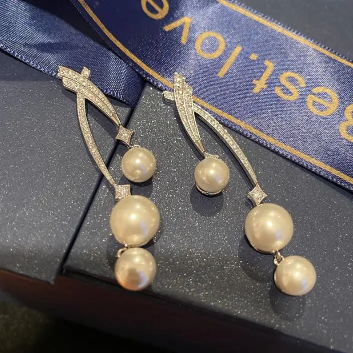 

Simple line cross pearl pendant earrings fashionable high-end comet popular silver needle temperament long earrings