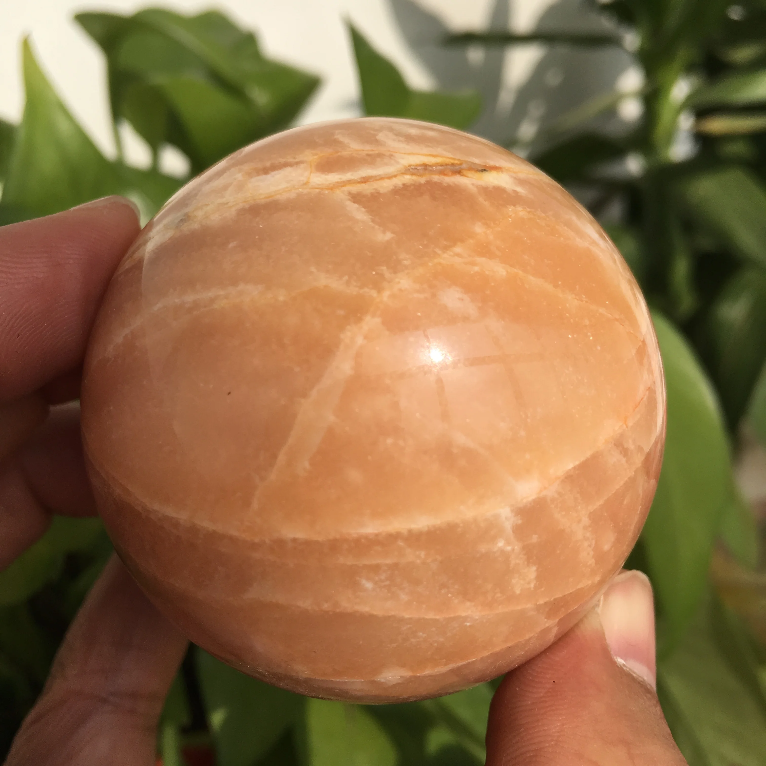

Natural orange Dongling jade ball healing energy stone