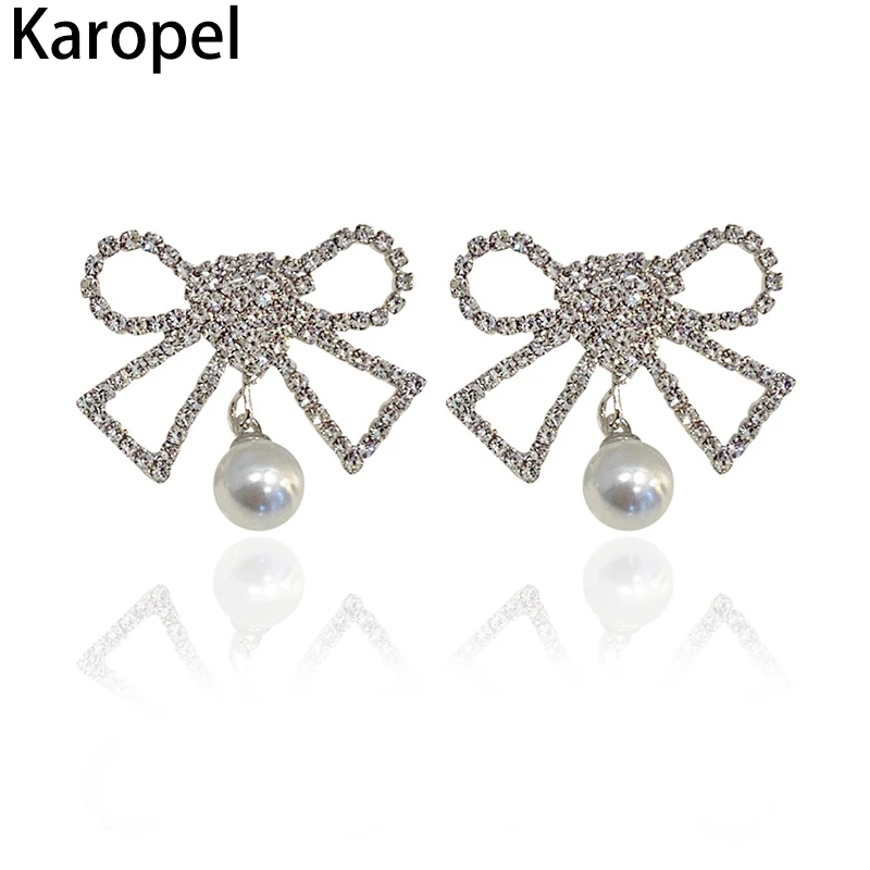 

Karopel Fashion Korean Rhinestone Bow Earrings for Women Fashion Bowknot Pendant Shining Bow Pearl Stud Jewelry Earring Gift