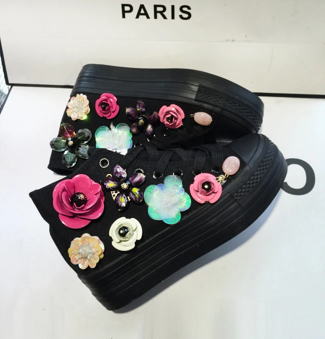 

New fashionable shoes, shiny sequins, big flowers, black high-top canvas shoes