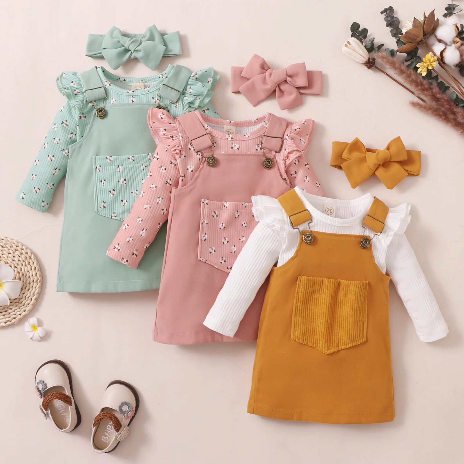 

New Infant Baby Girl’s Three Piece Suit Fashion Pitted Long Sleeve Romper and Pocket Suspender Skirt & Headband