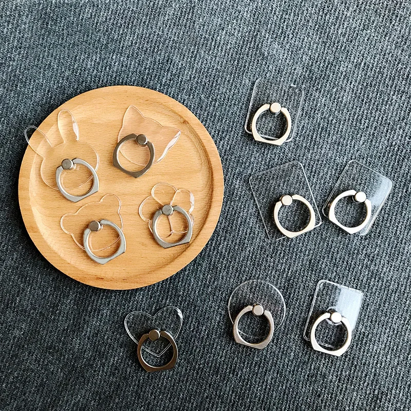 Мобильный телефон с подставкой держателем в виде кольца для мобильных устройств