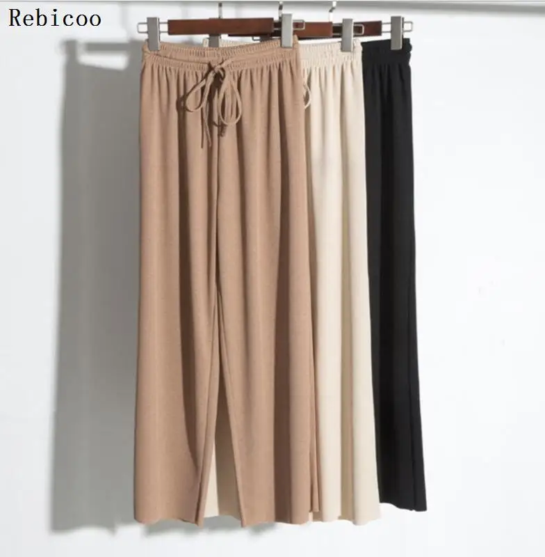 Женские летние тонкие трикотажные брюки черные широкие свободные до щиколотки