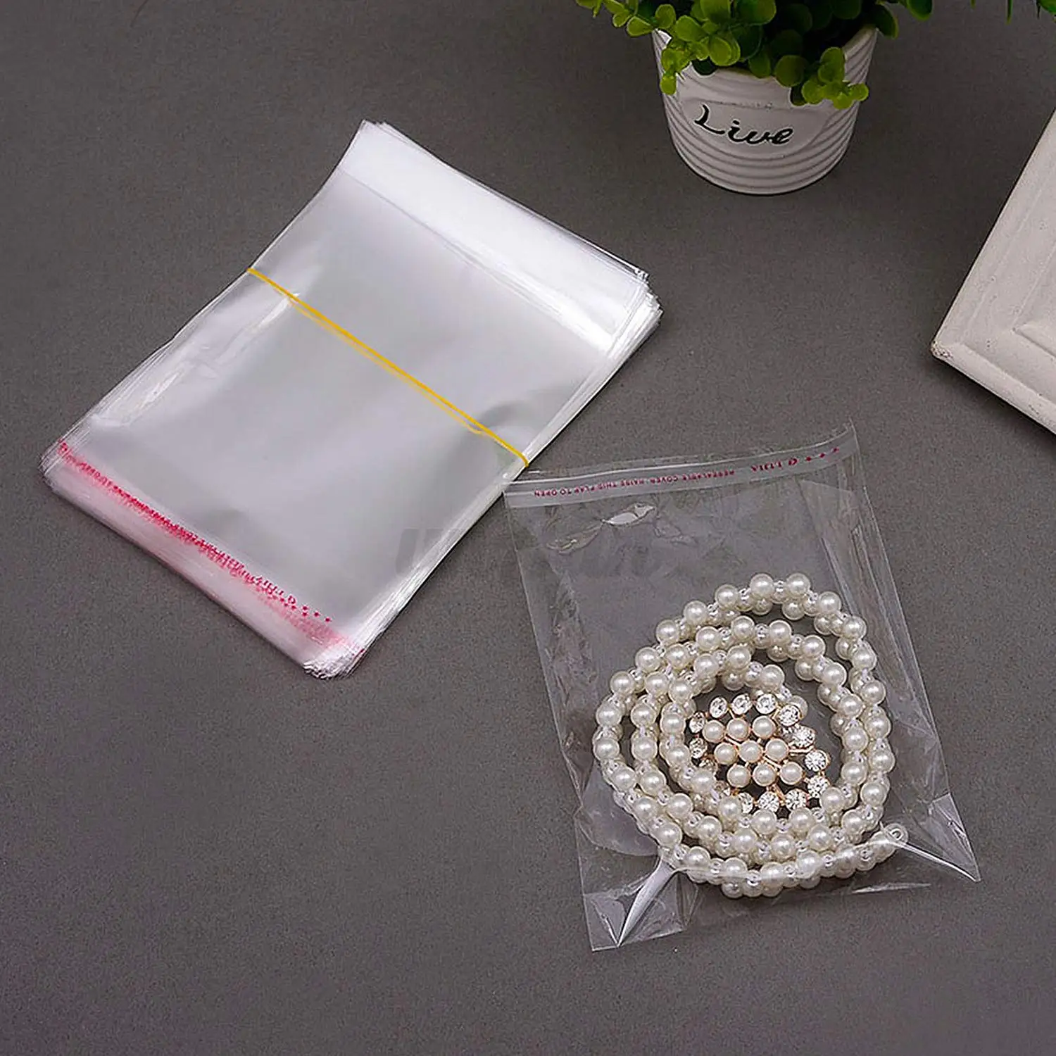 

100 Pcs Clear Apparel Bags Self Adhesive Plastic Bag OPP Self Seal Poly Bags for Jewelry Crafts Wig Small Gift Storage Pouches
