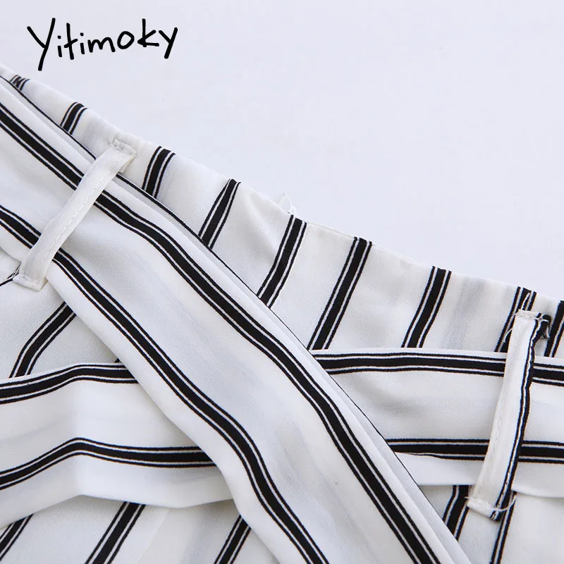 Весенние женские штаны с завязками на молнии черные полосатые белые высокой