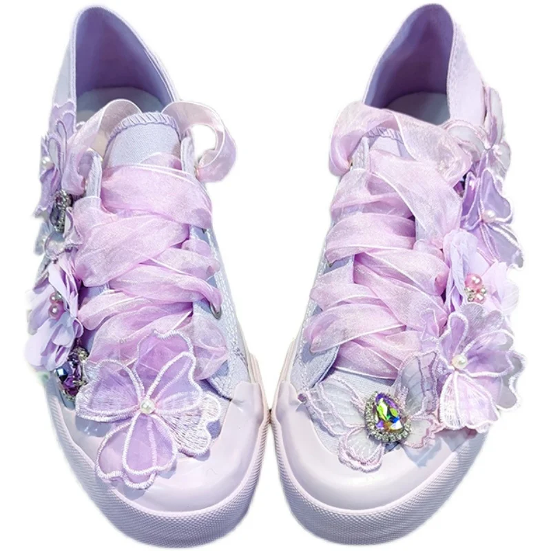 

The new two-wearing heel lazy shoes fairy wind flower drill tied with canvas shoe tide