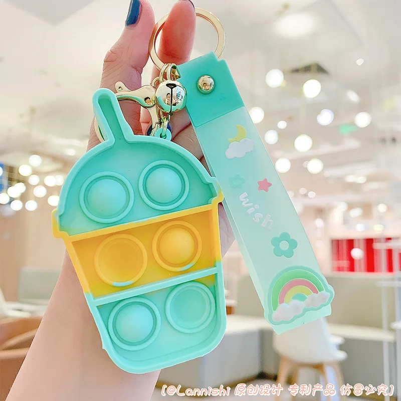 

Camouflage summer macarons color keychain toy silicone bubble music creative play the first cup of milk tea hand strap buckle ke