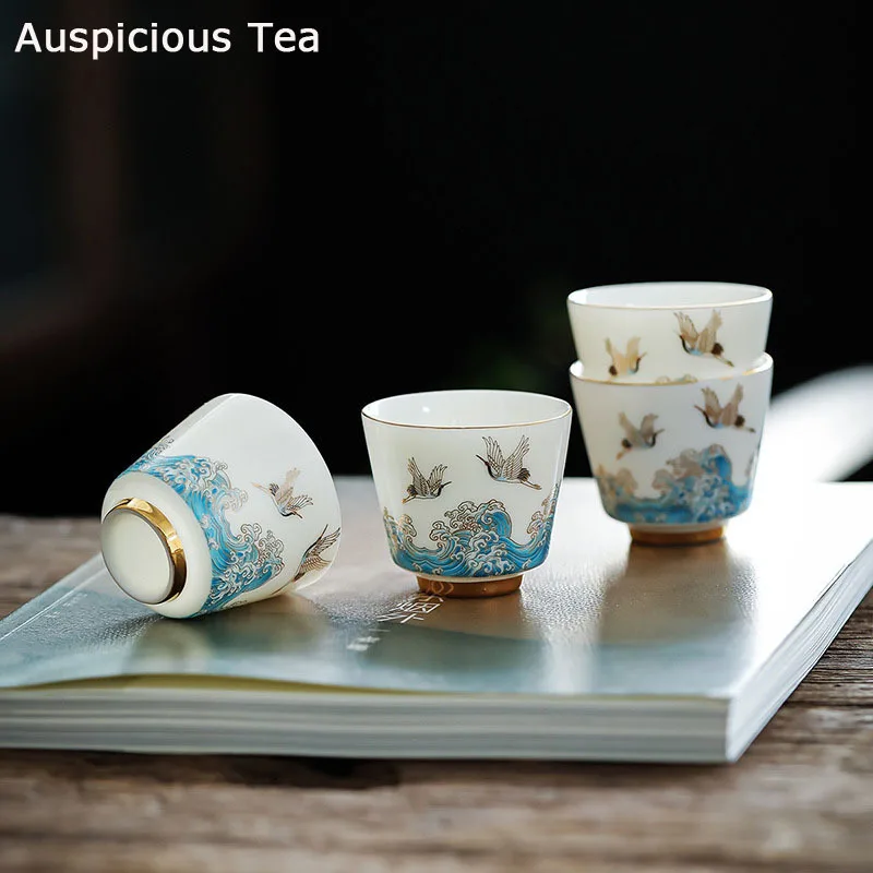 

2 шт./компл., 60 мл, белая фарфоровая чайная чашка из баранины и нефрита с эффектом благоприятности Crane Guanhai, креативный золотистый керамически...