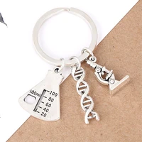 measuring cup chemical molecules microscope creative diy science physics student teacher learning keychain